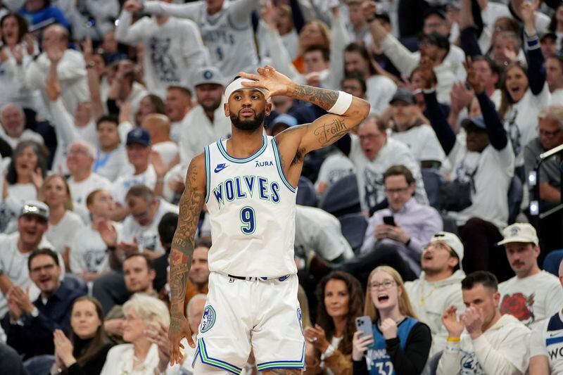 Minnesota Timberwolves guard Nickeil Alexander-Walker (9) gestures after making a 3-point shot against the Phoenix Suns during the second half of Game 2 of an NBA basketball first-round playoff series, Tuesday, April 23, 2024, in Minneapolis. (AP Photo/Abbie Parr)