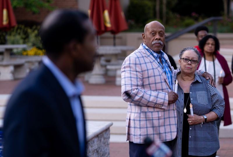 220420-Atlanta-Dwayne Heard and Jan Bryson listen to a speaker during a vigil for the victims of gun violence held by 100 Black Men of Atlanta on Wednesday evening, Apr. 20, 2022 at the King Center. Heard is a member of the group. Ben Gray for the Atlanta Journal-Constitution
