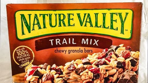 Nature Valley granola bars will  lose the 100 percent natural label after parent company General Mills settled a recent lawsuit after it was found that the oats used contained a small amount of a cancer-linked pesticide.