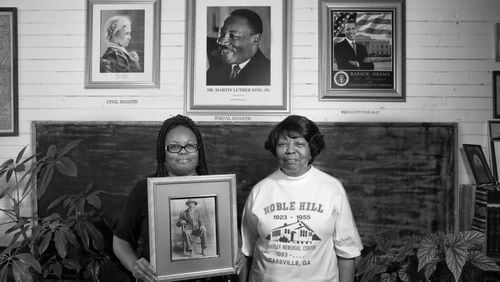 Valerie Coleman (left) and Marian Coleman hold a photo of their ancestor Webster Wheeler, who migrated to Detroit, but returned to Cassville, Ga., to help build the Noble Hill School. That school is now a cultural heritage and community center, curated by Valerie Coleman, great-great-great granddaughter of Wheeler. Valerie's aunt, Marian Coleman, is one of the last graduates of Noble Hill. The two are part of the effort to create a National Park unit dedicated to the Rosenwald schools. Photo: Andrew Feiler