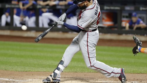 Nick Markakis hits an RBI double Tuesday at New York. He left that night to attend to a personal matter at his home outside Baltimore and rejoined the Braves for Thursday’s game at Miami. (AP Photo/Frank Franklin II)