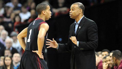 SPOKANE, WA - MARCH 20: Head coach Tommy Amaker of the Harvard Crimson talks to Siyani Chambers #1 of the Harvard Crimson during their game against the Cincinnati Bearcats in the second round of the 2014 NCAA Men's Basketball Tournament at Spokane Veterans Memorial Arena on March 20, 2014 in Spokane, Washington. (Photo by Steve Dykes/Getty Images)