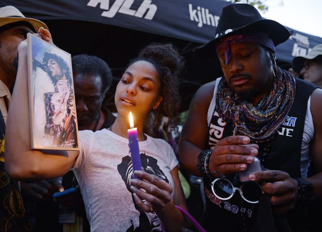 Photos: Prince fans pay tribute to his memory, music