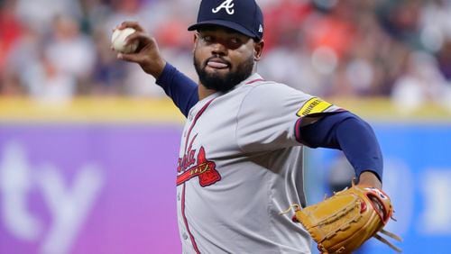 Atlanta Braves starting pitcher Reynaldo Lopez throws to a Houston Astros batter during the first inning of a baseball game Tuesday, April 16, 2024, in Houston. (AP Photo/Michael Wyke)