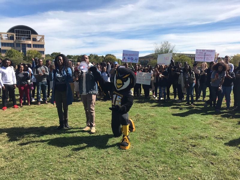 A few hundred Kennesaw State University students and faculty marched Monday in support of five cheerleaders who knelt during the national anthem at a football game Sept. 30. They characterised their gesture as a stand against injustice and racism. Since then, the cheerleaders have not been allowed to take the field until after the anthem since Meris.Lutz@ajc.com