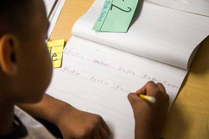 A first grader practices writing within the lines during class at Harper-Archer Elementary School in Atlanta, Wednesday, February 26, 2020. (ALYSSA POINTER/ALYSSA.POINTER@AJC.COM)