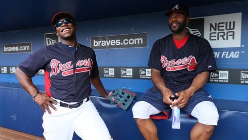 Heyward (right) is still able to manage a little smile as Justin Upton (left) welcomes him back in the dugout. Hayward didn’t have to have his jaw wired shut. It is stabilized with rubber bands that are attached to braces on his teeth.