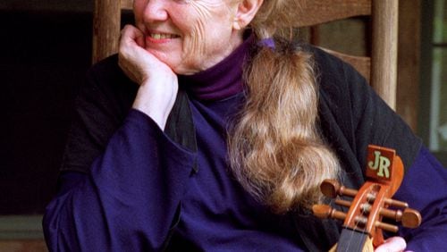 Folk legend Jean Ritchie sits outside her cabin with George Pickow, husband, noted New York photographer and film maker in Viper, Kentucky, in 1997. Jean Ritchie died June 1, 2015. (AJC Staff Photo/John Harmon) October 1997