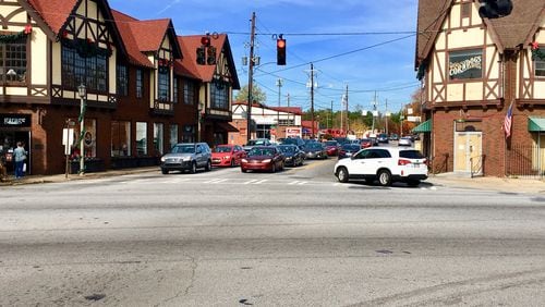 This heavily traveled intersection at Clarendon Road and U.S. 278 in downtown Avondale Estates will get extensive repairs in 2018. This includes the curb radius where this white car is turning right, where curbing is frequently run over and destroyed by buses and trucks. Bill Banks for the AJC