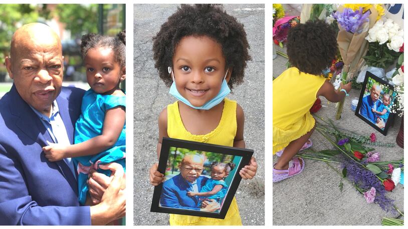 In 2018, two-year-old Pheonix Lewis and her mother Saidah Lewis, bumped into John Lewis at Atlantic Station. Naturally, they took a photo with the congressman. To mark his passing, Pheonix Lewis visited his mural and left flowers - and the photo.
