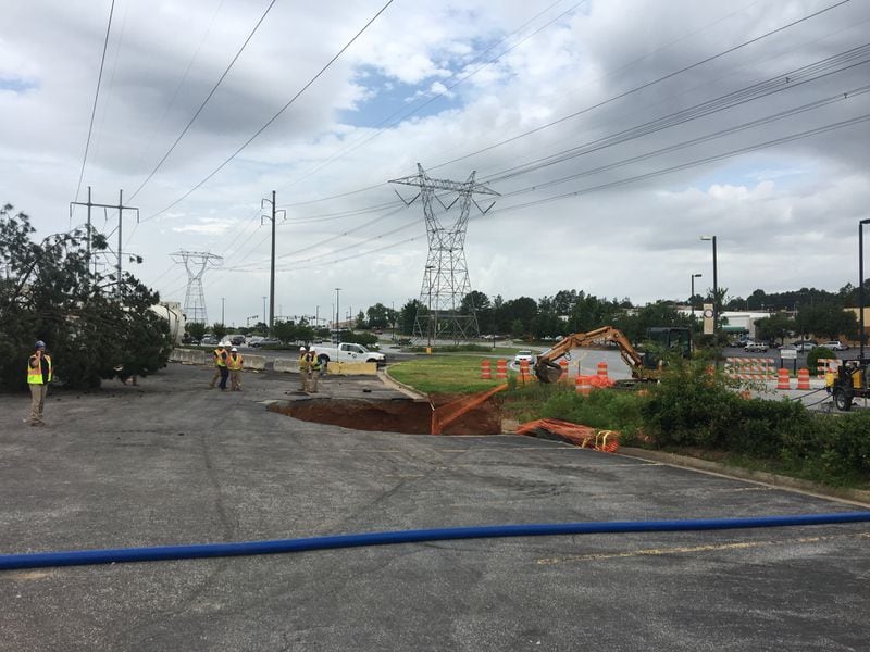 Crews are working to repair two sinkholes that have opened on Venture Drive near Gwinnett Place Mall.