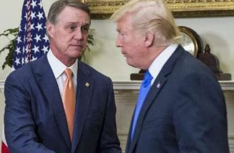 A special grand jury in Fulton County that investigated Donald Trump (right) and his allies' meddling in the 2020 elections grilled former U.S. Sen. David Perdue (left) about a meeting at Truist Park in December 2020 when he pressed Kemp to convene a special session. (Zach Gibson/Sipa USA/TNS)