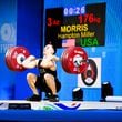 Hampton Morris completes a 176 kilogram clean and jerk, breaking the senior world record in the 61-kilogram weight class and qualifying for the 2024 Paris Olympics. He is the first American to break a senior world record in weightlifting since 1969.