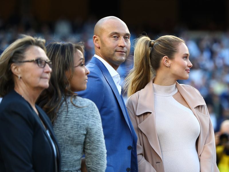 Derek Jeter looks on with wife Hannah Davis and the rest of his family during the retirement ceremony of his number 2 jersey at Yankee Stadium Sunday.