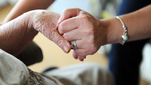 Alzheimer’s disease takes a toll on caregivers, too. (Photo credit: Bita Honarvar /AJC 2015 file)