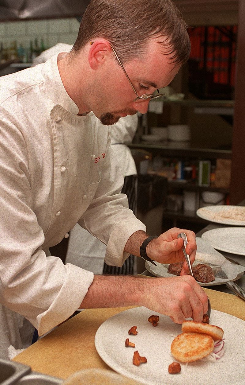 Shaun Doty prepares leg of lamb with risotto cake in 1997. / AJC file photo