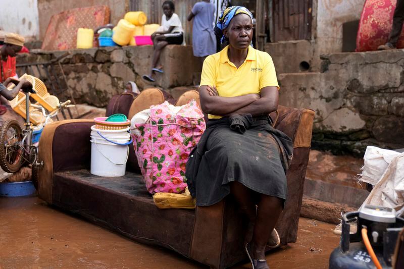 A displaced woman sits on a couch outside her flooded house, after heavy rain in the Mathare slum of Nairobi, Kenya, Wednesday, Apr. 24, 2024. Heavy rains pounding different parts of Kenya have led to the deaths of at least 35 people since mid-March and displaced more than 40,000 people, according to the U.N., which cites Red Cross figures in the most recent update. (AP Photo/Brian Inganga)