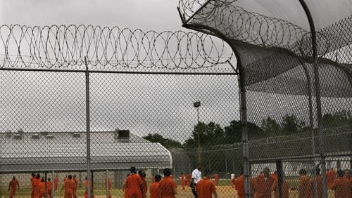 Detainees exercise during a recreation period earlier this year at the Irwin County Detention Center in Ocilla. Corrections Corporation of America, which is closing the detention center in Gainesville, earlier this year bid $13 million to acquire the Irwin facility, but another company won the bankruptcy auction.