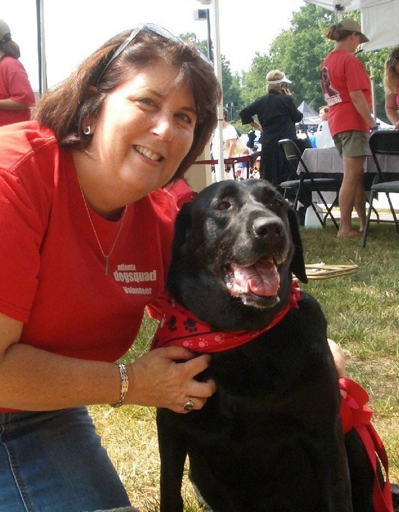 Toni Appling, with her dog Libby in 2008, is shown at a Dunwoody Fourth of July parade where she set up a booth for the Atlanta Dog Squad. CONTRIBUTED BY TONI APPLING
