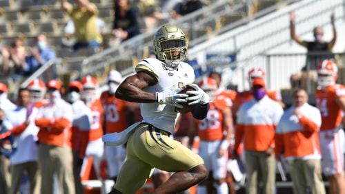 Georgia Tech wide receiver Jalen Camp (1) sprints toward the end zone for a touchdown in the first half of Saturday's game against Clemson at Georgia Tech.