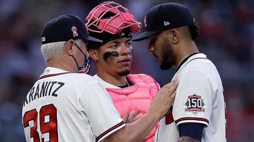 Braves pitcher Huascar Ynoa (right) speaks with pitching coach Rick Kranitz (39) and catcher William Contreras during the first inning against the Philadelphia Phillies Sunday, May 9, 2021, at Truist Park in Atlanta. (Ben Margot/AP)