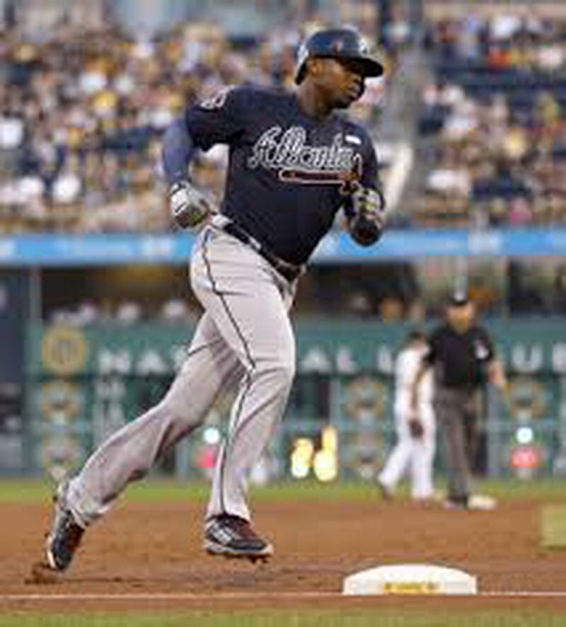 Justin Upton rounds the bases after his three-run homer Tuesday. He drove in five runs and hit the fourth homer of his 10-game hitting streak. (AP photo)