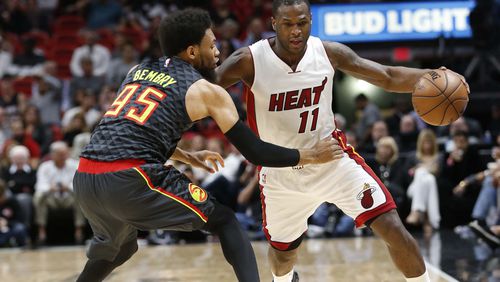 Miami Heat guard Dion Waiters (11) is defended by Atlanta Hawks forward DeAndre Bembry (95) during the first half of an NBA basketball game, Wednesday, Feb. 1, 2017, in Miami. (AP Photo/Wilfredo Lee)