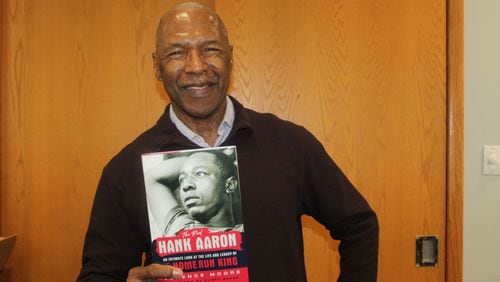 Longtime Atlanta sports writer Terence Moore holds a copy of his book, "The Real Hand Aaron: An Intimate Look at the Life and Legacy of the Home Run King," on Saturday at the Smyrna Public Library. (Photo Courtesy of Brian McKeithan)