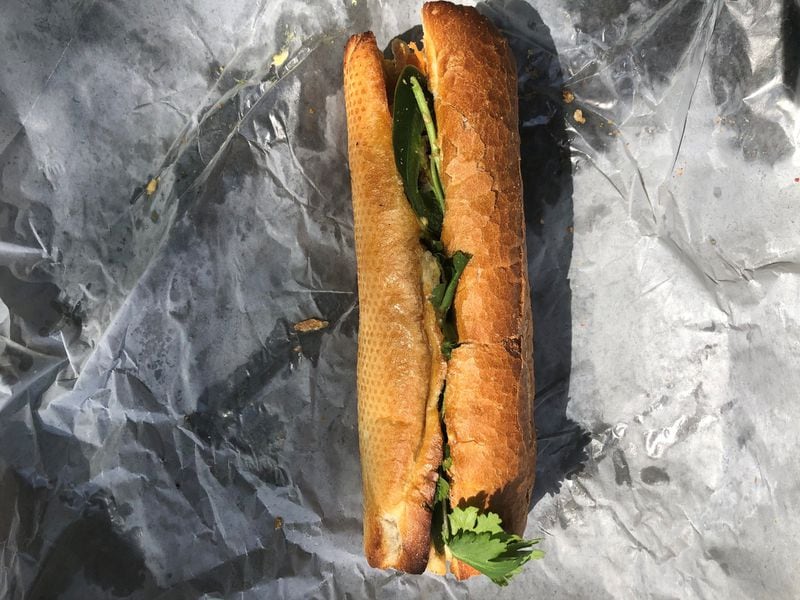 A takeout order of the crispy catfish sandwich (banh mi ca) from Vietvana Pho Noodle House in Avondale. CONTRIBUTED BY WENDELL BROCK