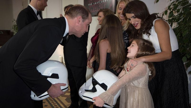 LONDON, ENGLAND - DECEMBER 12: Prince William, Duke of Cambridge is pictured with a Stormtroppers helmet and Eloisa Lerner, 8 yeard old, as they attend the European Premiere of 'Star Wars: The Last Jedi' at Royal Albert Hall on December 12, 2017 in London, England.  (Photo by Eddie Mulholland - WPA Pool/Getty Images)