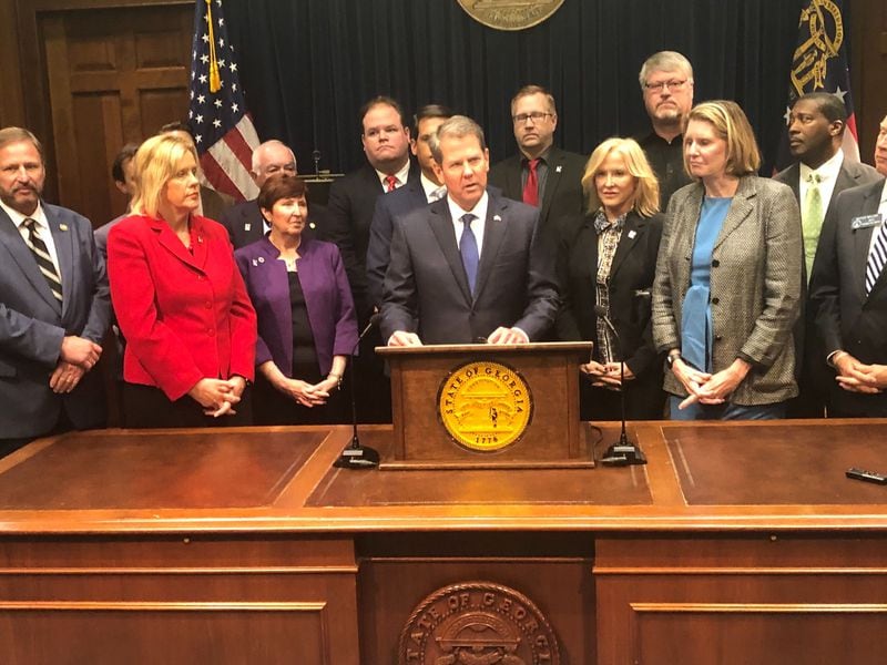 Gov. Brian Kemp unveiled a plan Thursday that would invest more than $300 million in public money into reinsurance — money that would be paid to insurance companies and meant to trickle down and lower premium prices. The plan would also require the state to build its own online system that would guide residents to private web brokers who could sell them insurance.