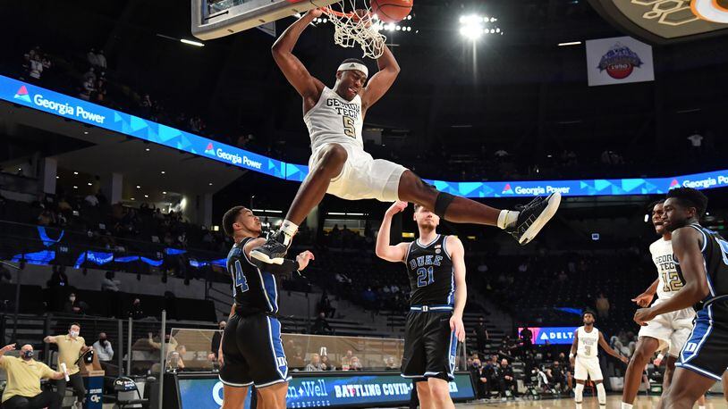 Georgia Tech forward Moses Wright (5) hangs on the basket after dunking the ball in the second half of an NCAA college basketball game at Georgia Tech's McCamish Pavilion in Atlanta on Tuesday, March 2, 2021. Georgia Tech won 81-77 over Duke in overtime. (Hyosub Shin / Hyosub.Shin@ajc.com)