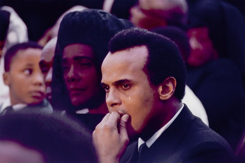 Coretta Scott King and Harry Belafonte grieve at the Rev. Martin Luther King Jr.’s gravesite at South View Cemetery in Atlanta on April 9, 1968. DECLAN HAUN / CONTRIBUTED BY CHICAGO HISTORY MUSEUM