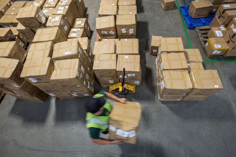 SAVANNAH, GA - JUNE 04, 2021: A Fulfillment.com employee sorts boxes according to customerÕs orders. (AJC Photo/Stephen B. Morton)