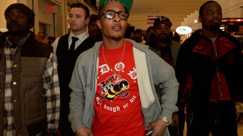 Rapper T.I. makes a special appearance at The PUMA Lab Powered by Foot Locker at Foot Locker at the Gallery at South Dekalb Mall on February 6, 2014 in Atlanta. (Photo by Rick Diamond/Getty Images for PUMA)