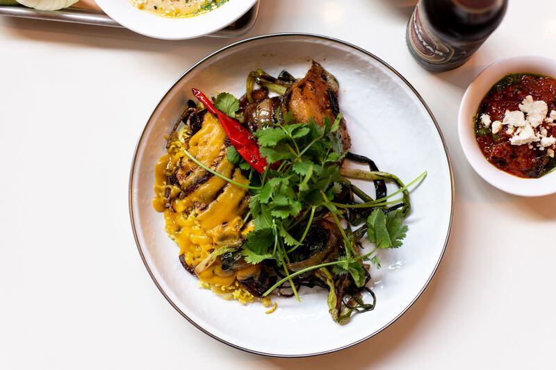 Amba Chicken with Perisan rice and charred vegetables. Photo credit- Mia Yakel.