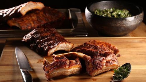 A Spanish-inspired marinade of paprika, pounded garlic and olive oil lends an earthy depth to ribs made in the oven. (Abel Uribe/Chicago Tribune/TNS)