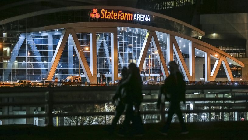 January 24, 2020 Atlanta: Morning walkers stroll past State Farm Arena on Monday morning, Jan. 27, 2020 where the Atlanta Hawks played Sunday night mindful of the tragic deaths of Kobe Bryant, who was killed in a helicopter crash along with his daughter and seven others Sunday. Atlanta Hawks Trae Young reflected on the tragedy Sunday following the Hawks game at State Farm Arena. âWe didnât have a lot on our mind besides Kobe and Gigi and everybody in the accident,â Young told Fox Sports Southeastâs Andre Aldridge in his postgame interview after his electric performance. âWe just wanted to go out and play hard, have that mamba mentality.â Gianna, a budding student of the game, was a big fan of Youngâs, who attended some basketball camps of Bryantâs back in high school and watched him play in Oklahoma City in the later years of his career, when he wore No. 24 (the Wizards took a 24-second shot-clock violation to start Sundayâs game). Bryant eventually got in contact with Youngâs trainer, Alex Bazzell, and enlisted his help working with Gianna. She and Bryant sat courtside for two Hawks games this season: the loss in Los Angeles Nov. 17 and the loss in Brooklyn Dec. 21.  In the wake of the crash, Young tweeted about meeting Gianna for the first time after the Lakers game, posting a picture of the two of them about to embrace in a hallway in Staples Center as Bryant looked on. âShe told me how much she loved watching me play,â Young said of the encounter, a smile cracking through the sadness. âShe was a big fan of mine.â JOHN SPINK/JSPINK@AJC.COM