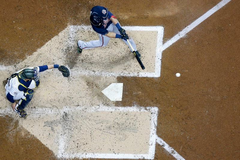 Atlanta Braves' Austin Riley hits a two-run scoring single during the third inning of a baseball game against the Milwaukee Brewers Friday, May 14, 2021, in Milwaukee. (AP Photo/Morry Gash)