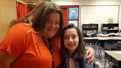 Teacher Emily Howell, shown with an unidentified student, was killed in a May 2018 wreck in Paulding County.