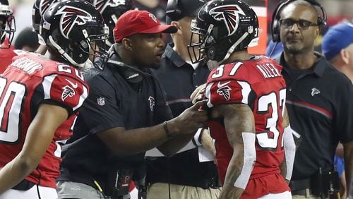 Atlanta Falcons secondary coach Marquand Manuel talks to safety Ricardo Allen (37) during an NFC Championship NFL game against the Green Bay Packers on Sunday, January 22, 2017. The Falcons defeated the Packers 44-21. (Kevin Terrell via AP)