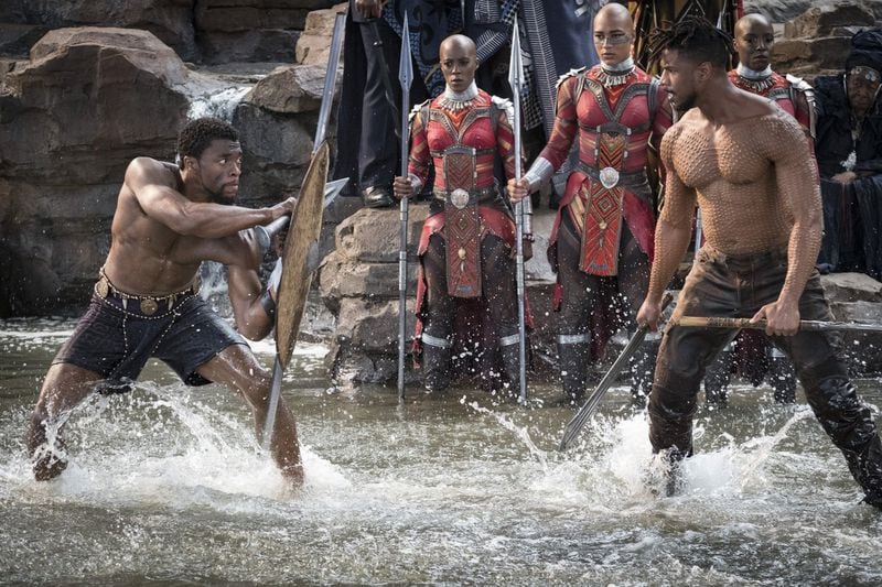 T’Challa/Black Panther (Chadwick Boseman) and Erik Killmonger (Michael B. Jordan) are shown in a scene from “Black Panther,” which opens Feb. 16 but already has black audiences excited about it. CONTRIBUTED BY MATT KENNEDY / MARVEL STUDIOS