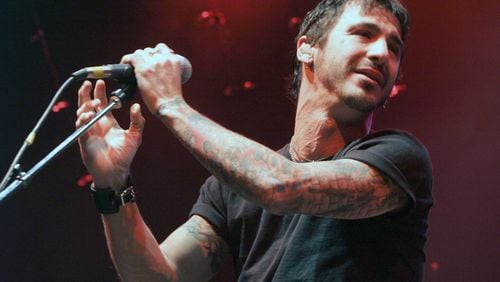 Vocalist Sully Erna of  Godsmack performs an acoustic show in 2004, the same year their acoustic EP, “The Other Side,” was released. (AP Photo/ Robert E. Klein)