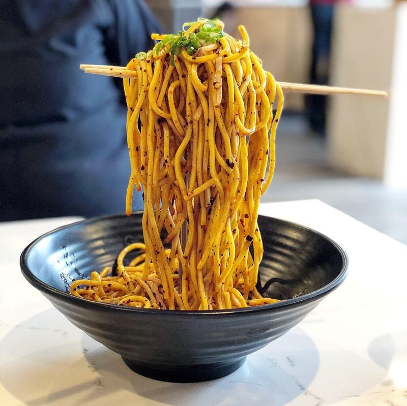 The Chengdu cold noodles at Gu’s Kitchen in Chamblee arrive draped on chopsticks balanced on a rod hidden by the noodles — and look as if suspended in midair. CONTRIBUTED BY JENNIFER ZYMAN