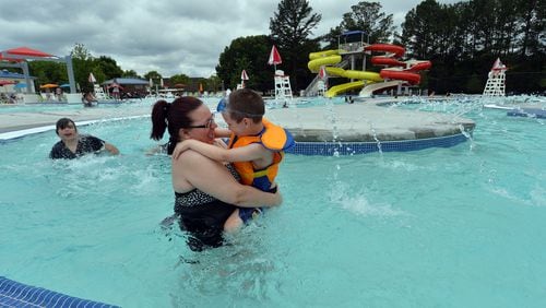 Deanna Thrasher and her son, Landon, 5, enjoy floating down the Lazy River in the Seven Springs Water Park in Powder Springs in summer 2015. KENT D. JOHNSON /KDJOHNSON@AJC.COM