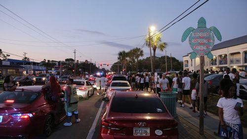 FILE: Party-goers hang out in the street during stand-still traffic caused by Orange Crush in April this year.