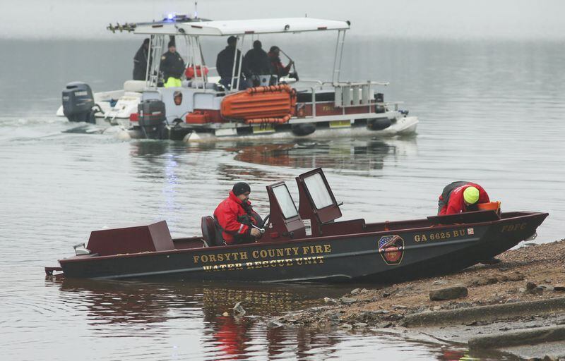 Divers and other personnel from several agencies search for a drowning victim on Lake Lanier in 2013. Lake Lanier is the deadliest body of water in Georgia, according to data analyzed by the AJC. JOHN SPINK / JSPINK@AJC.COM