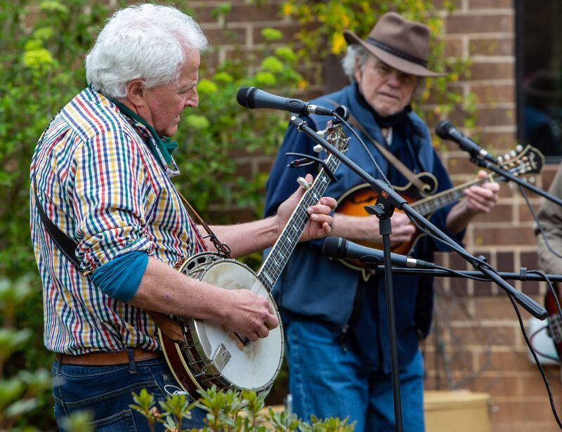 The Druid Hills Billys band members Paul Parker (left) and Jim Culliton perform at Clairmont Place in Decatur. The band, made up of physicians in the area, which regularly played at Clairmont Place before the pandemic, kept it up and increased performances during the lockdown. They played outdoors with residents listening from their balconies. PHIL SKINNER FOR THE ATLANTA JOURNAL-CONSTITUTION.