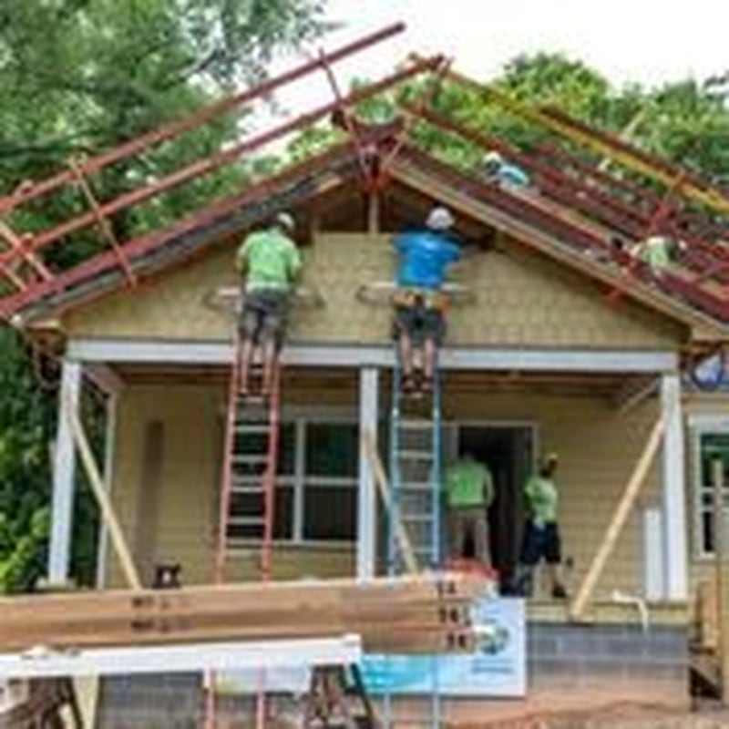 Associates of the Blank Foundation and Novelis assemble siding at a Habitat for Humanity home built with proceeds from recycled aluminum cans. The home is part of efforts to revitalize the neighborhood adjacent to the new Mercedes-Benz Stadium. Contributed