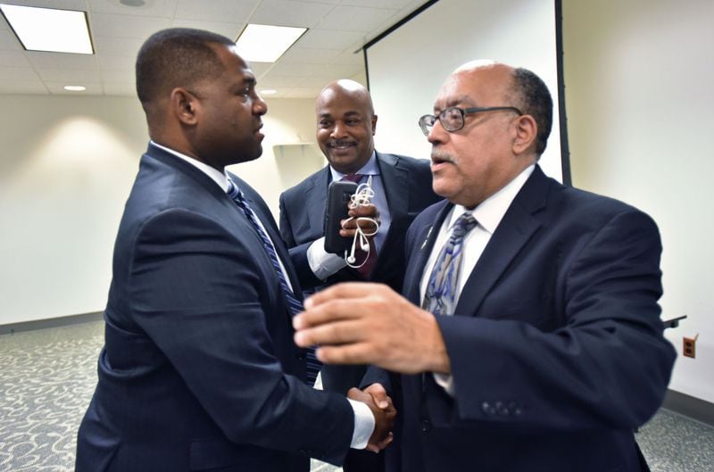 Atlanta mayoral candidates (from left) Ceasar Mitchell, Kwanza Hall and Vincent Fort greet one another after their candidates forum at Georgia State Bar Headquarters on Feb. 24, 2017. HYOSUB SHIN / HSHIN@AJC.COM